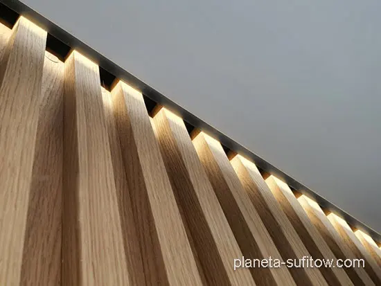 illumination of wooden slats from the ceiling